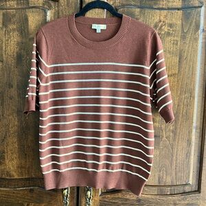 Brown short sleeve light sweater with white stripes.